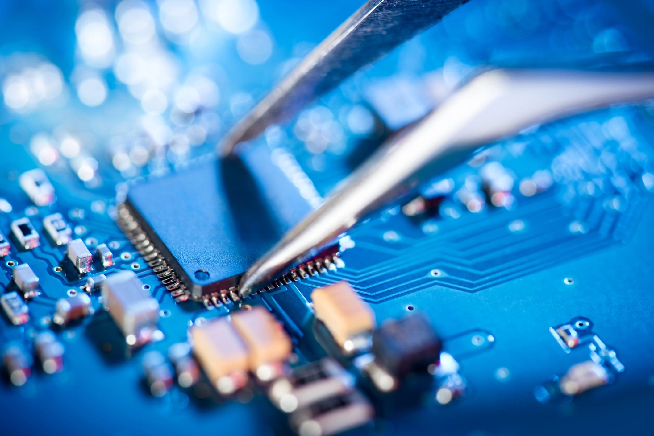 Technician working on a circuit board repair