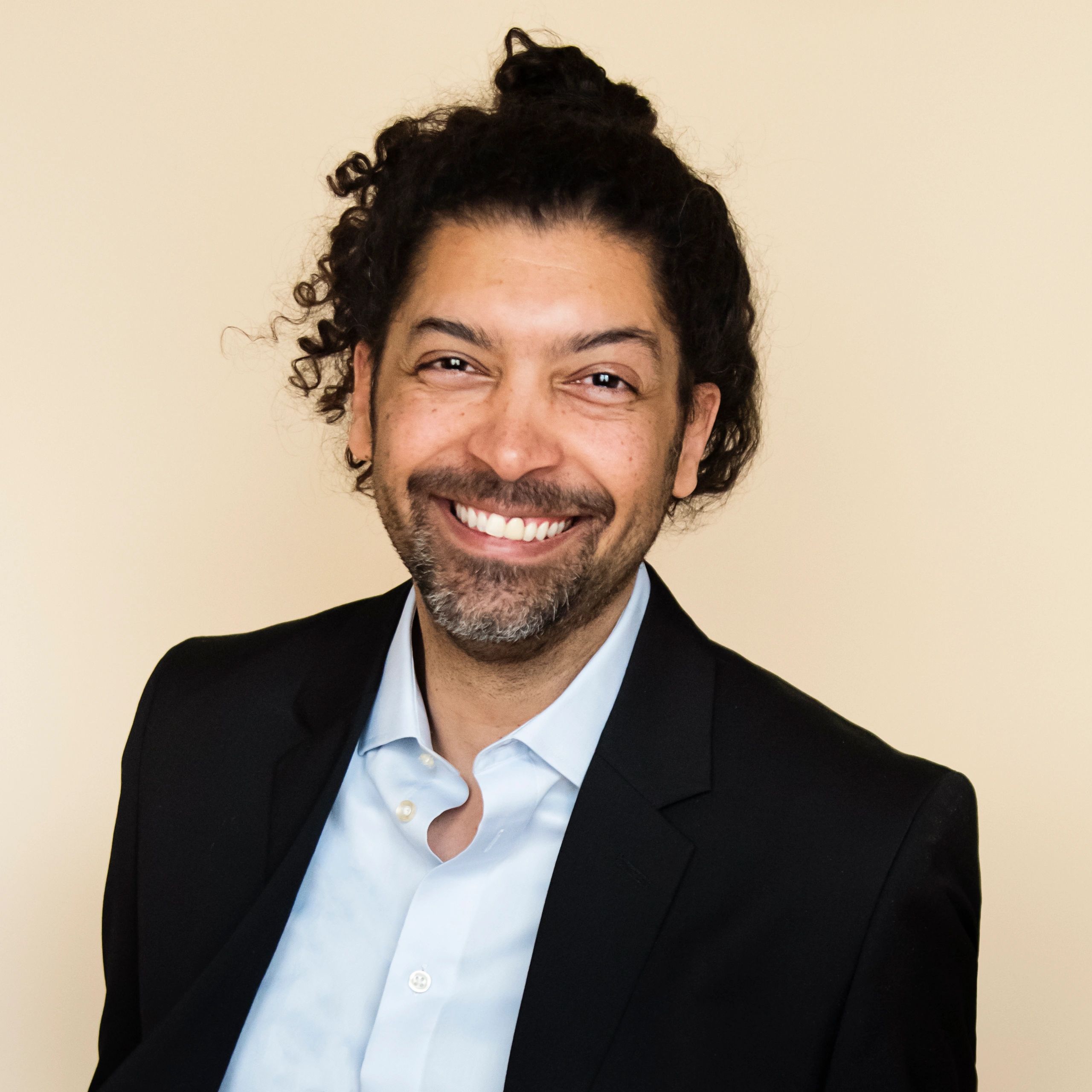Professional headshot of a male team member