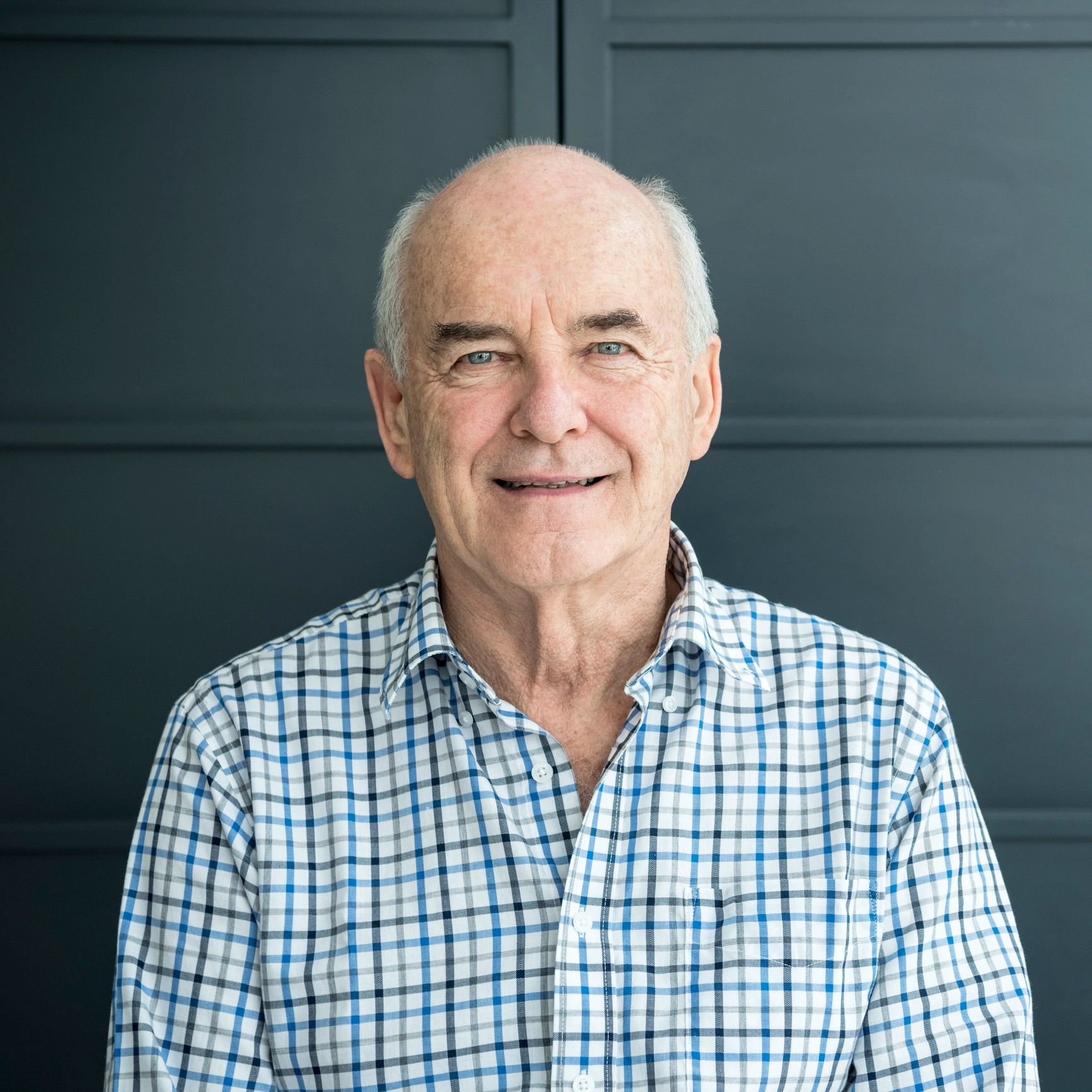 Professional headshot of a male team member